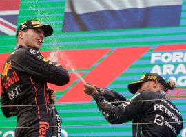 The Hungarian GP second place finisher. Lewis Hamilton, sprays winner Max Verstappen with champagne on Sunday. Two days later Hamilton announced his ownership stake in the Denver Broncos. (Image: Reuters)