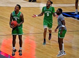 Javion Hamlet and his teammates at North Texas jump for joy after upsetting #4 Purdue in the first round of the March Madness college basketball tournament. (Image: Christopher Hanewinckel/USA Today Sports)