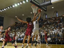 Yale forward Paul Atkinson shoots against Harvard at John J. Lee Amphitheater in New Haven, CT. (Image: Lukas Flippo/Yale Athletics)