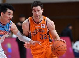 Jimmer Fredette of the Shanghai Sharks drives the lane against the Sichuan Blue Whales during a night he dropped 70 points in the CBA in China. (Image: Xinhua/Sipa USA)