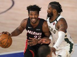 Jimmy Butler of the Miami Heat guarded by Milwaukee's Wesley Matthews in Game 1. (Image: AP)