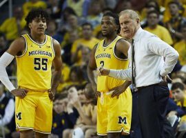 Michigan guards Eli Brooks (55) and Zavier Simpsons (3) with head coach John Beilein (right) during a home game in Ann Arbor. (Image: Rick Osentoski/USA Today Sports)