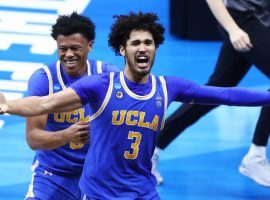 UCLA sophomore swingman Johnny Juzang celebrates an upset victory over #1 Michigan in the Elite 8. (Image: Mark J. Rebilas/USA Today Sports)