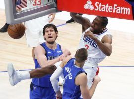 Kawhi Leonard of the LA Clippers throws down a monster dunk over the Texas Towers â€“ 7-foot-4 Boban Marjanovic and 7-foot-3 Kristaps Porzingis â€“ from the Dallas Mavericks in Game 6. (Image: Getty)