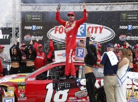 Kyle Busch outraced his brother Kurt off a late restart to win on Sunday at Bristol Motor Speedway. (Image: Wade Payne/AP)