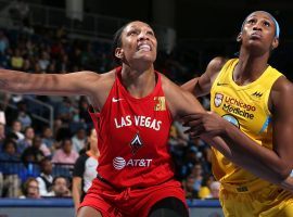 Aâ€™ja Wilson (left) came back from injury to lead the Las Vegas Aces to a win over Chicago on Sunday, a victory that clinch a playoff berth for the team. (Image: Gary Dineen/NBAE/Getty)