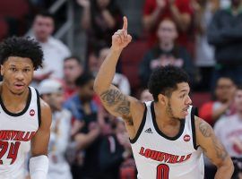 Louisville freshman Dwayne Sutton (24) and Senior Lamarr Kimble (0) run back on defense after a fast break at the Yum Center in Louisville. (Image: Dominique Yates/Louisville Courier Journal)