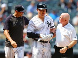 Yankees Manager Aaron Boone checks on 1B Luke Voit after he got hit in the face with a pitch in July at Yankee Stadium. (Image: Mike Strobe/Getty)