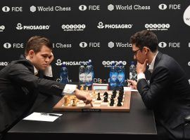 Magnus Carlsen (left) and Fabiano Caruana (right) will face off in the Chessable Masters quarterfinals, a rematch of their 2018 World Championship match. (Image: Facundo Arrizabalaga/EPA)