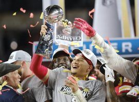 Kansas City Chiefs quarterback, Patrick Mahomes. hoists the Super Bowl trophy after winning Super Bowl LIV. (Image: AJ Mast/Getty)