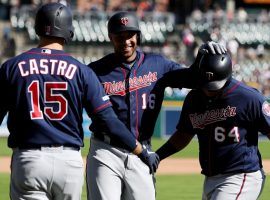 Jason Castro (15) and Willians Astudillo (64) of the Minnesota Twins congratulate Jonathan Schoop (16) for hitting the team's 300th home run of the season. (Image: AP)