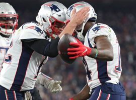 New England Patriots QB Tom Brady congratulates WR Mohamed Sanu for a touchdown against the Baltimore Ravens. (Image: Getty)