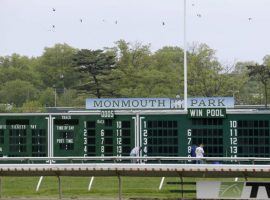 The Monmouth Park toteboard is due for some changes on the win-place-show side when fixed-odds wagering takes effect. New Jersey Gov. Phil Murphy is expected to sign the bill legalizing fixed-odds horse wagering in time for the July 17 Haskell Stakes. (Image: Seth Wenig/AP Photo)