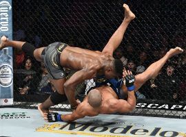 Francis Ngannou (top) came from behind to beat Ciryl Gane (bottom) in the main event of UFC 270 on Saturday. (Image: Chris Unger/Zuffa)