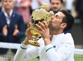 Novak Djokovic tied Roger Federer and Rafael Nadal with his 20th Grand Slam win at Wimbledon, and could break the record at the US Open. (Image: Toby Melville/Reuters)