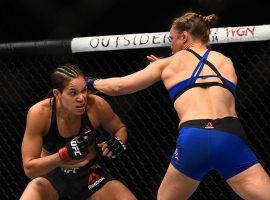 Amanda Nunes dodges a punch from Ronda Rousey during their championship fight on December 30, 2016. Nunes will defend her bantamweight title this weekend at UFC 224.  (Image: Jeff Bottari/Zuffa LLC/Getty)