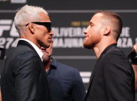 Charles Oliveira (left) will still fight Justin Gaethje (right) in the main event at UFC 274, but wonâ€™t have his lightweight title after missing weight on Friday. (Image: Chris Unger/Zuffa/Getty)