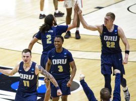 Oral Roberts celebrates a major upset victory over Ohio State, ranked #7 in the country, in the first round of the March Madness college basketball tournament. (Image: Getty)