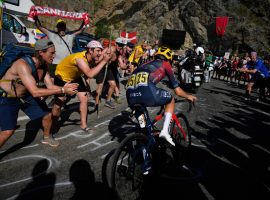 Rowdy fans cheer on Tom Pidcock during his remarkable win at Alpe dâ€™Huez in Stage 12 of the Tour de France. (Image: Daniel Cole/AP)