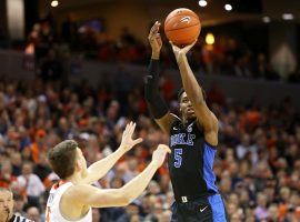 Duke freshman and leading scorer, RJ Barrett, shoots a three-pointer against Virginia at John Paul Johns Arena in Charlottesville, Virginia. (Image: Ryan R. Kelly/Getty)