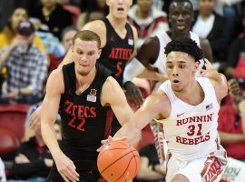 UNLV guard Marvin Coleman and San Diego State guard Malachi Flynn fight for a loose ball at Thomas & Mack Arena in Las Vegas. (Image: Ethan Miller/Getty)