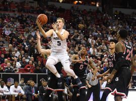 Utah State guard Sam Merrill beats several Fresno State defenders to the basket during the 2019 Mountain West Tournament in Las Vegas, NV. (Image: Justin Tafoya/AP)