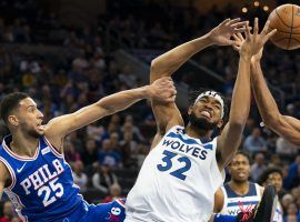 Ben Simmons from the Philadelphia 76ers fouls Karl-Antony Towns from the Minnesota Timberwolves. (Image: Mitchell Leff/Getty)