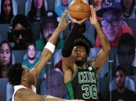 Marcus Smart of the Celtics shoots a 3-point against the Toronto Raptors in Game 2. (Image: Kim Klement/Getty)