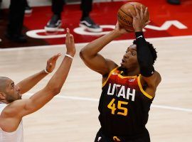 Donovan â€˜Spidaâ€™ Mitchell from the Utah Jazz hoists a 3-point shot over Nicolas Batum from the LA Clippers in Game 1 of the Western Conference semifinals in Salt Lake City. (Image: Jeffrey Swing/UAS Today Sports)