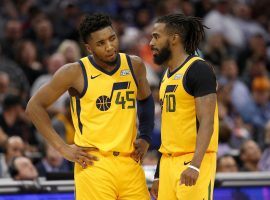 Utah Jazz backcourt players -- Donovan Mitchell and Mike Conley -- discuss strategy during a 2020 game in Utah. (Image: Rich Pedroncelli/AP)