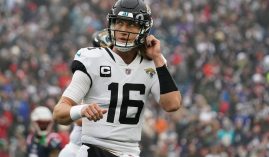 A dejected Trevor Lawrence from the Jacksonville Jaguars heads off the field after throwing an interception. (Image: Getty)