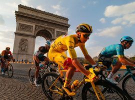 Tadej Pogacar rides into Paris with the yellow jersey as the winner of the 2020 Tour de France. (Image: Christophe Ena/AP)