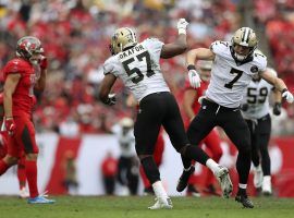 The New Orleans Saints' Alex Okafor (57) celebrates with Taysom Hill (7) after Hill's first blocked punt in the NFL. (Kevin Jairaj/USA Today)