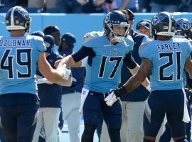 Â Tennessee Titans quarterback Ryan Tannehill celebrates a touchdown strike with teammates against the Indianapolis Colts in September. (Image: Mark Zaleski/AP)