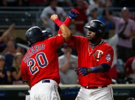 Minnesota Twins LF Eddie Rosario congratulates DH Nelson Cruz after hitting a home run at Target Park in Minneapolis. (Image: Brad Rempel/USA Today Sports)