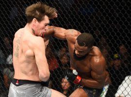 Tyron Woodley (right) throws a punch during his win over Darren Till (left) in the main event of UFC 228 on Sept. 8, 2018. (Image: Josh Hedges/Zuffa/Getty)