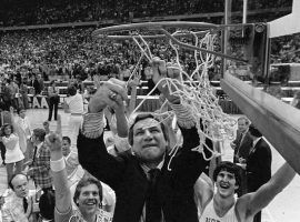 Dean Smith, head coach of North Carolina, cuts down the net after winning the 1982 college basketball championship. (Image: AP)