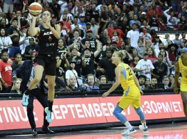 Dearica Hamby (left) throws up a half-court shot that would prove to be the game-winner for the Las Vegas Aces over the Chicago Sky in Sundayâ€™s WNBA playoffs second-round matchup. (Image: Jeff Bottari/NBAE/Getty)