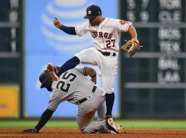 NY Yankees SS Gleyber Torres slides under 2B Houston Astros Jose Altuve. (Image: Shanna Lockwood/USA Today Sports)