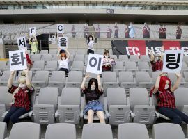 The South Korean football team FC Seoul had sex dolls dressed in team colors as fans for their match against Gwangju FC (Image: Ryu Young-suk/AP)