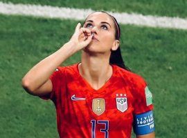 Alex Morgan tips a teacup against English team (image: flipboard.com)