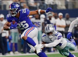 NY Giants RB Saquon Barkley evades a tackler in a Week 1 loss to the Dallas Cowboys. (Image: Porter Lambert/Getty)