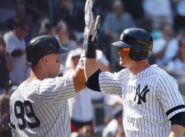 Aaron Judge congratulates teammate DJ LeMahieu after hitting a lead-off home run against the Toronto Blue Jays at Yankee Stadium. (Image: Porter Lambert/Getty)