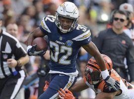 Rookie RB Justin Jackson evades a tackler in a game against the Cincinnati Bengals. (Image: Mark J. Terrill/AP)