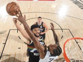 Kawhi Leonard of the LA Clippers blocks Denver guard Jamal Murray in Game 3. (Image: Getty)