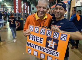 Furniture store owner and local celebrity Jim "Mattress Mack" McIngvale poses with a fan during a World Series game at Minute Maid Park in Houston. (Image: Darren Rovell/Twitter)