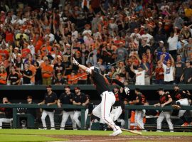 Orioles' Trey Mancini drives home the winning run against the Angels on July 8, 2022. Both Mike Trout and Shohei Ohtani hit homeruns, to no avail. (Image: Julio Cortez/AP)