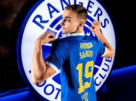 James Sands poses in the Glasgow Rangers shirt after his move was officially confirmed by his new club. (Image: rangers.co.uk)